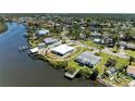 Waterfront home with a private dock, lush greenery, and serene water views at 603 Ravenna N St, Nokomis, FL 34275