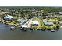 Waterfront home boasting lush landscaping, a private dock, and a tranquil canal view at 603 Ravenna N St, Nokomis, FL 34275