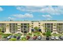 Aerial view of the complex featuring landscaped grounds, parking, and two buildings at 6124 43Rd W St # 404A, Bradenton, FL 34210