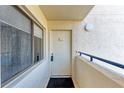 Exterior of condo door with security features and a modern design, providing a welcoming entrance at 835 S Osprey Ave # 101, Sarasota, FL 34236