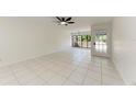 Bright living room with white tile flooring and natural light at 835 S Osprey Ave # 101, Sarasota, FL 34236