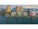 Waterfront building with manicured landscaping offers a serene living environment near downtown at 101 Sunset Dr # 103, Sarasota, FL 34236