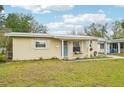 Attractive single-story home with manicured lawn and neutral siding, providing a welcoming curb appeal at 108 21St Ne St, Bradenton, FL 34208