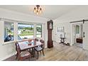Inviting dining room with natural light and charming vintage-style furnishing at 1208 Angela Maria Rd, Sarasota, FL 34243