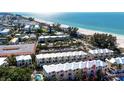 Beautiful aerial view of beachside townhomes with stunning ocean proximity at 1429 Gulf N Dr, Bradenton Beach, FL 34217