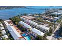 Stunning aerial view of townhomes with pool, Intracoastal Waterway, and canal access at 1429 Gulf N Dr, Bradenton Beach, FL 34217