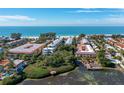 Wonderful aerial view showing beach access and community waterway at 1429 Gulf N Dr, Bradenton Beach, FL 34217