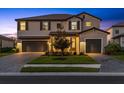 Charming two-story home with a three-car garage and manicured front yard at 16455 Whale Grey Pl, Bradenton, FL 34211