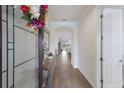 Bright foyer showcasing tiled flooring, a decorative mirror, and an arched doorway at 16719 Ellsworth Ave, Bradenton, FL 34202