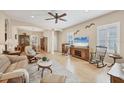 Cozy living room with wood floors, comfortable seating, and ample natural light at 21037 Anclote Ct, Venice, FL 34293