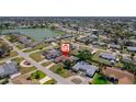 Aerial view of property shows proximity to a nearby lake and neighborhood amenities at 260 Hammock Ter, Venice, FL 34293