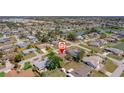Wide aerial view of neighborhood including lake, golf course, and community park areas at 260 Hammock Ter, Venice, FL 34293