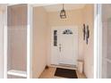 A view of the front door, and the light and bright entryway at 4268 Mulgrave Ave, North Port, FL 34287