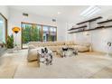 Bright living room showcases contemporary decor, a plush sectional sofa, and large windows at 587 47Th St, Sarasota, FL 34234