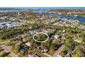 Aerial view of a neighborhood featuring homes, waterways, and a central property at 603 Frances St, Nokomis, FL 34275