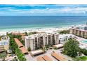 Stunning beachfront condo building with pristine white sand and turquoise ocean views at 6342 Midnight Pass Rd # 212, Sarasota, FL 34242