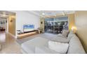 Bright and inviting living room featuring a comfortable sectional sofa and views of the patio at 6731 Northampton Pl, Bradenton, FL 34207