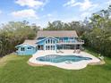 Aerial view of backyard with a large pool and a spacious patio great for entertaining at 7330 Westmoreland Dr, Sarasota, FL 34243