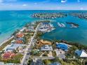 Aerial view showing waterfront new construction home with a stunning coastal location and a nearby marina at 821 S Bay Blvd, Anna Maria, FL 34216