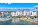 Lakeside condominium complex featuring lush landscaping, walking trails, and ample parking at 10520 Boardwalk Loop # 503, Bradenton, FL 34202