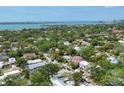 Breathtaking aerial view of a luxurious neighborhood near the water, surrounded by lush greenery and city skyline at 1879 Hibiscus St, Sarasota, FL 34239