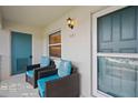Relax on the private patio with comfortable seating, creating a welcoming outdoor space at 321 108Th W St # 120, Bradenton, FL 34209