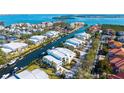 An aerial view of a waterfront community with beautiful canals and multi-story residences at 4104 128Th W St # 704, Cortez, FL 34215