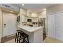 Bright kitchen featuring stainless steel appliances and a breakfast bar at 4110 Central Sarasota Pkwy # 123, Sarasota, FL 34238
