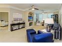 Spacious living room showcasing coastal style decor and ample natural light at 4110 Central Sarasota Pkwy # 123, Sarasota, FL 34238