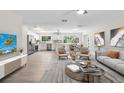 Open concept living space blending seamlessly into the modern kitchen and dining area, perfect for entertaining at 4493 Mckibben Dr, North Port, FL 34287