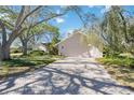 Inviting single-story home with a brick driveway and well-maintained landscaping, offering great curb appeal at 4965 Marsh Field Rd, Sarasota, FL 34235