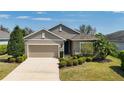 Charming single-Gathering home featuring a two-car garage, well-maintained landscaping and a welcoming front entrance at 5011 Kincaid Park Ln, Bradenton, FL 34211