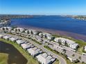 Waterfront condo community featuring multiple buildings, covered parking, and lush landscaping at 1020 Tidewater Shores Loop # 107, Bradenton, FL 34208
