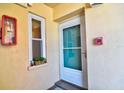 Inviting front door with a window, enhancing the curb appeal at 1250 N Portofino Dr # 201, Sarasota, FL 34242
