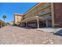 Covered parking featuring pavers and easy access to the residences at 1250 N Portofino Dr # 201, Sarasota, FL 34242