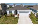 Charming single-story home featuring a two car garage and landscaped front yard at 17715 Cantarina Cv, Bradenton, FL 34211