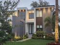 Exterior facade with water feature and manicured front yard at 212 S Renellie Dr, Tampa, FL 33609