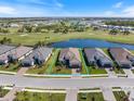 Stunning aerial view of a home on a golf course with a lake, showcasing its prime location at 3564 Santa Caterina Blvd, Lakewood Ranch, FL 34211