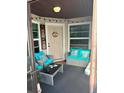 Inviting screened-in porch featuring comfortable seating and charming decor at 3784 59Th W Ave # 3784, Bradenton, FL 34210