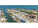 Waterfront property boasts a screened lanai, a private boat dock, and convenient canal access at 3808 Royal Palm Dr, Bradenton, FL 34210