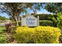 Community sign for Arbor Oaks, a deed restricted neighborhood with beautiful landscaping at 6905 Arbor Oaks Ct, Bradenton, FL 34209