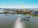 An aerial view showcasing a waterfront condo with docks, and nearby ocean access at 8767 Midnight Pass Rd # 403F, Sarasota, FL 34242