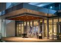 Condominium entrance featuring a modern design with a wood-paneled ceiling and floor-to-ceiling windows at 1155 N Gulfstream Ave # 708, Sarasota, FL 34236