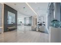 Spacious lobby with modern decor, sleek tile flooring, and stylish seating areas at 1155 N Gulfstream Ave # 708, Sarasota, FL 34236