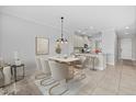 Cozy dining area that opens to the kitchen with bright natural light at 13711 Messina Loop # 101, Bradenton, FL 34211