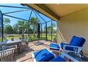 Enjoy outdoor living on this screened-in patio, furnished with comfortable seating and a dining area at 17696 Northwood Pl, Lakewood Ranch, FL 34202