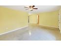 Spacious living room with terrazzo floors, light-colored walls, and plenty of room at 18348 Yale Ave, Port Charlotte, FL 33948