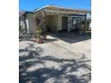 Inviting home with a covered carport and a quaint, welcoming facade at 2714 Avenue C, Holmes Beach, FL 34217