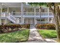 Condo exterior featuring beautiful landscaping and inviting walkways at 3702 54Th W Dr # 103, Bradenton, FL 34210