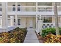 Inviting entrance with lush landscaping and a charming walkway leading to the front door at 3702 54Th W Dr # 103, Bradenton, FL 34210